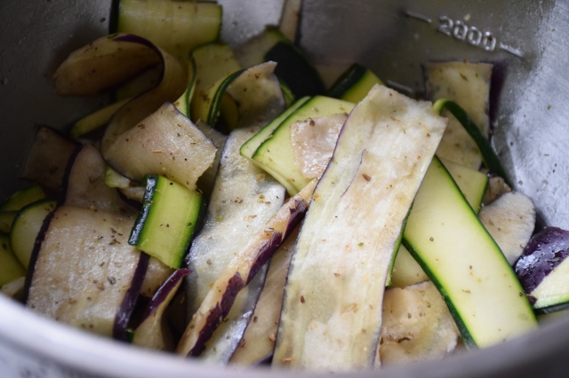 toss the vegetable slices with olive oil, salt, pepper, and dried herbs